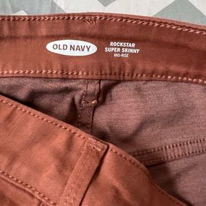 Rust colored skinny leg pants